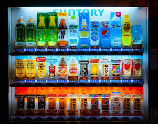 Assorted drinks inside a vending machine